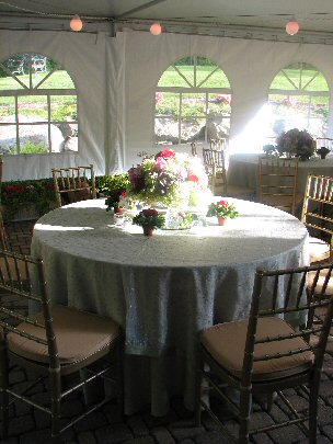 5 foot round table with floral arrangement