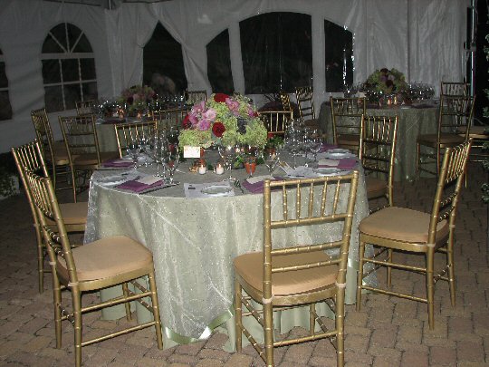 five foot round table with chairs and formal settings