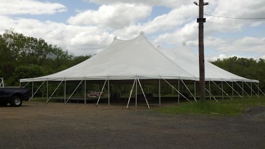 60ft x 90ft pole tent installed on grass